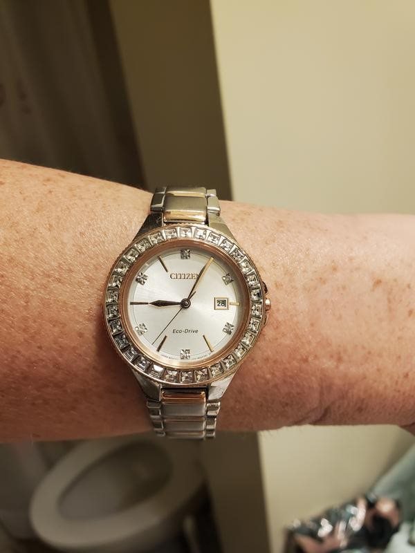 FE1196-57A שעון יד סיטיזן אקו דרייב סולארי לנשים | דגם משולב זהב רוז באזל משובץ 30 אבני סברובסקי | שנתיים אחריות | Silhouette Crystal Silver Dial Ladies Watch FE1196-57A by Citizen