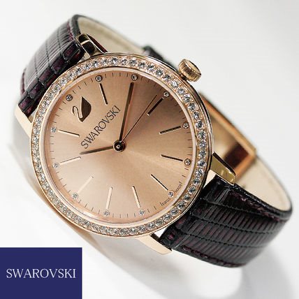 5261472 שעון יד אלגנטי ומיוחד של סברובסקי לנשים | דגם בלוח שמפניה ברצועת עור מיוחדת | מנגנון שווצרי | Quartz Crystal Rose Dial Purple Leather Ladies Watch 5261472 by Swarovski