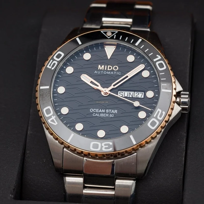 M0424302105100 שעון מידו מסדרת אושן סטאר החדשה לגברים | דגם אוטומטי 80 שעות עם באזל קרמי רוז גולד | לוח שחור מושלם | שנתיים אחריות יבואן רשמי | MIDO Ocean Star 42.5mm Black & Rose M042.430.21.051.00