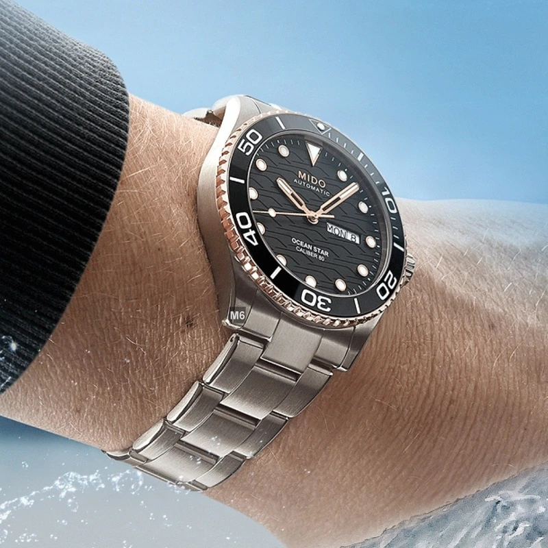 M0424302105100 שעון מידו מסדרת אושן סטאר החדשה לגברים | דגם אוטומטי 80 שעות עם באזל קרמי רוז גולד | לוח שחור מושלם | שנתיים אחריות יבואן רשמי | MIDO Ocean Star 42.5mm Black & Rose M042.430.21.051.00