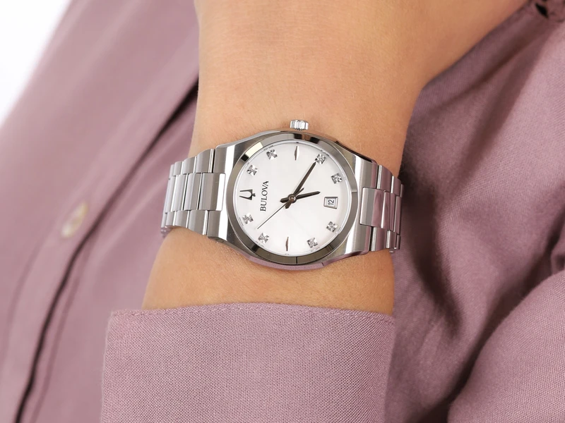 96P218 שעון יד בולבה לאישה | דגם חדש בלוח פנינה משובץ 8 יהלומים | שעון אלגנטי יוקרתי כולל שנתיים אחריות | מלאי מוגבל | Bulova Women';s Surveyor Stainless Steel Diamond Dial 96P218