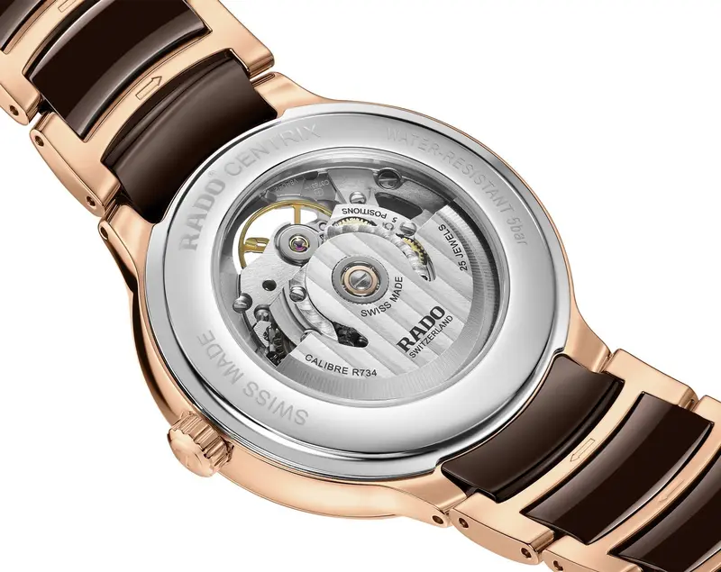 R-60283090 | R30028902 | ראדו יבואן רשמי בישראל | דגם סנטריקס סקלטון לגברים | אוטומטי עם 12 יהלומים בלוח פנינה חום | רוז גולד עם קרמיקה חומה | Centrix Automatic Diamonds Open Heart RADO R30028902