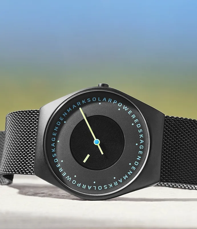 SKW6874 שעון סולארי של סקאגן לגברים | דגם אופנתי בלוח מרשים ומיוחד | רצועת רשת וקייס מושחרים | שנתיים אחריות יבואן רשמי | Skagen Grenen Solar Powered SKW6874 men';s watch