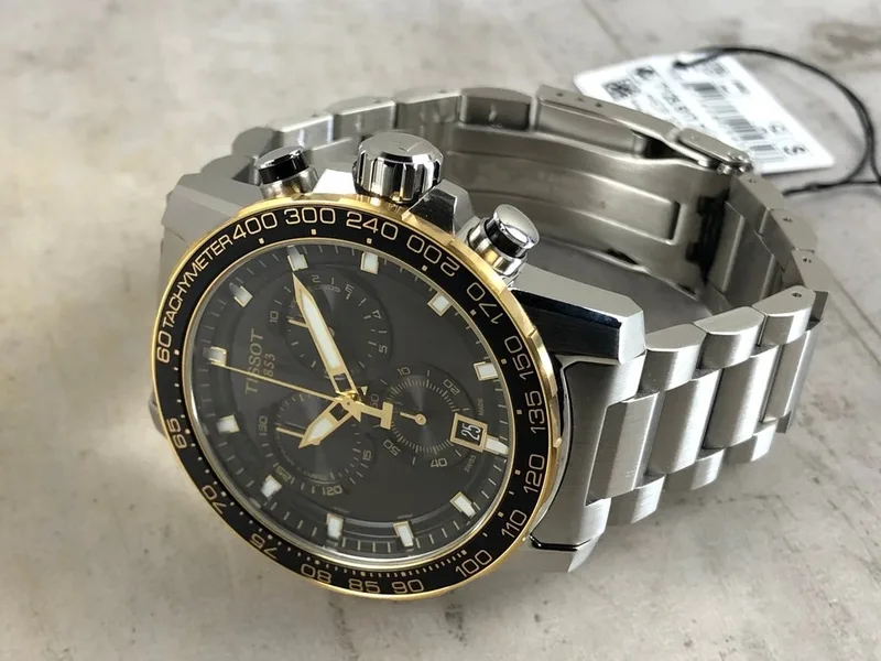 T125.617.21.051.00 שעון טיסו כרונוגרף לגברים | דגם ספורטיבי אלגנטי בלוח שחור כרונוגרף משולב זהב | Tissot T-Sport 45mm Mens Watch T1256172105100