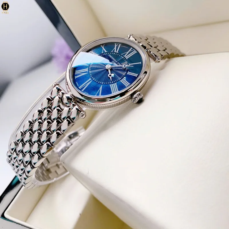 FC-200MPN2V6B שעון יוקרה לנשים של פרדריק קונסטנט | דגם אובלי בלוח פנינה כחול רומי | אבן ספיר בכתר | שעון מיוחד מלאי מוגבל | שנתיים אחריות יבואן רשמי בישראל | FREDERIQUE CONSTANT Art Deco 200MPN2V6B