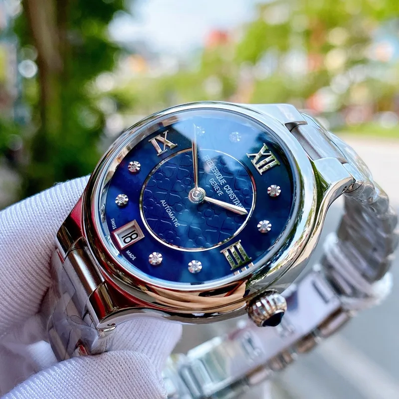 FC-306NHD3ER6B שעון יוקרתי לנשים של פרדריק קונסטנט שוויץ | שעון אוטומטי כסוף בלוח כחול פנינה משובץ | שעוני יוקרה לאישה | יבואן רשמי Frederique Constant Geneve Delight Automatic Ladies FC-306NHD3ER6B